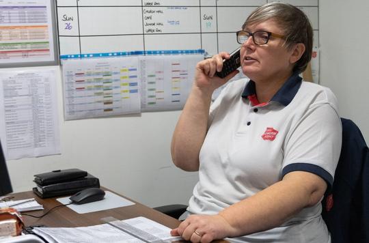 Carolyn in Droitwich speaking on the phone to an isolated older person