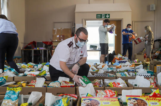 Officer in Watford packing food parcels