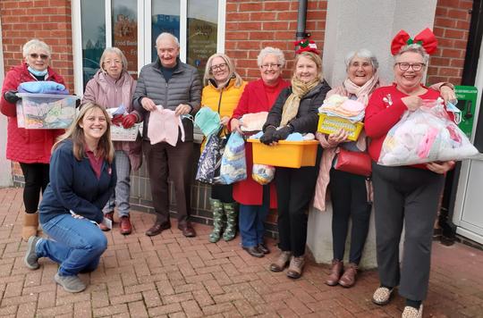 Thoughtful knitters use skills to support local charity