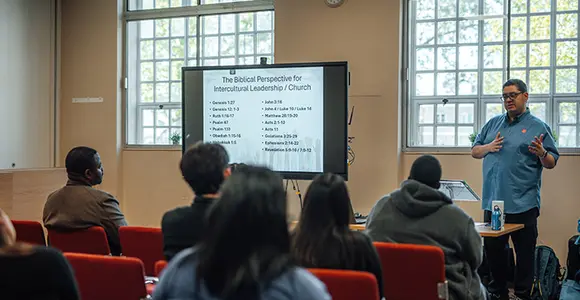 A class on intercultural leadership/church being taught. 