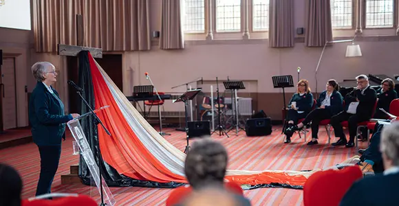 An officer speaking to an audience of William Booth College employees, officers and candidates during Holy Week 2026.