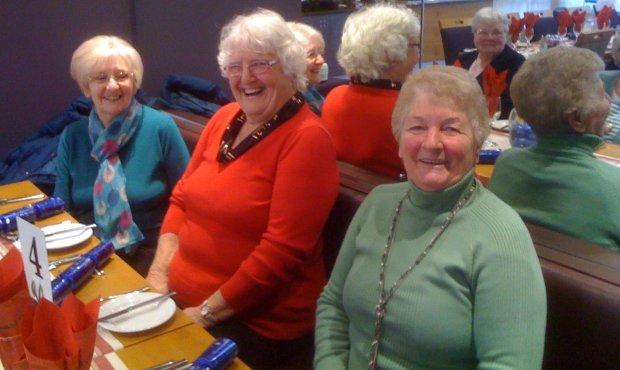 Three of the Cameo members enjoying Christmas meal at the Ramada. Leader Norma Brown on the left
