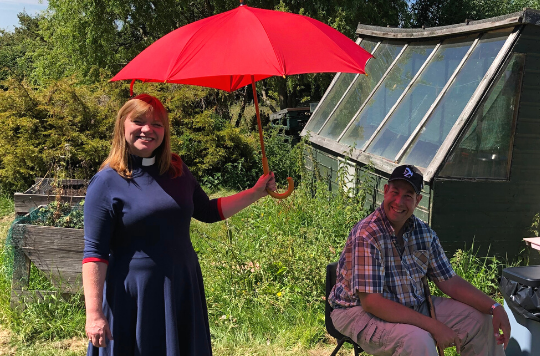 Rev Kate Bottley gives Anthony shade by holiding a parasol