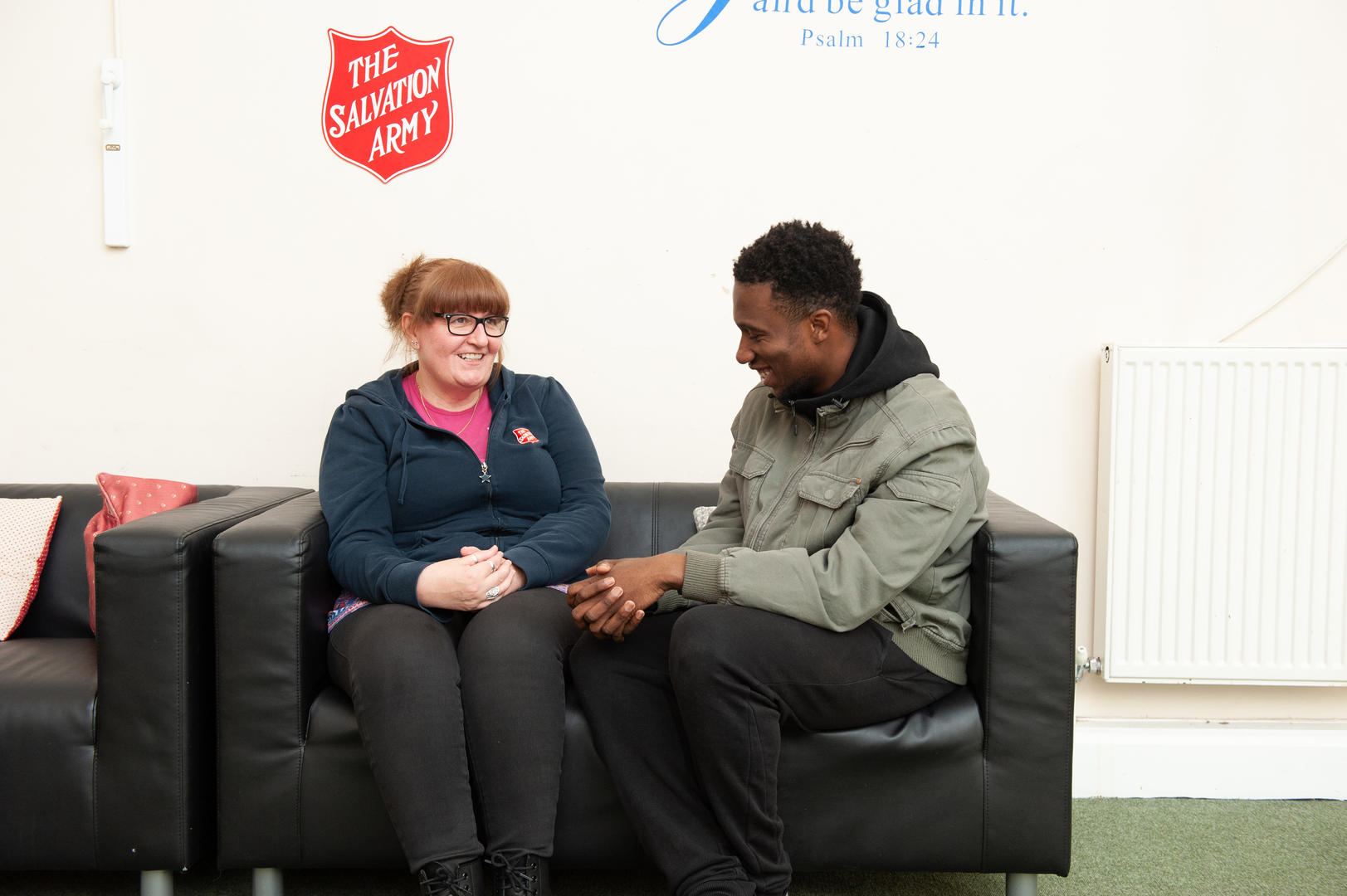 A man speaking to a Salvation Army officer at one of our centres