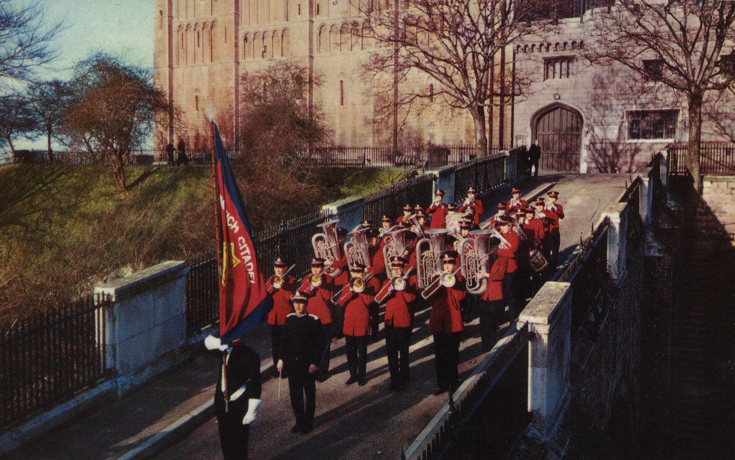 Norwich Citadel band marching with the flag