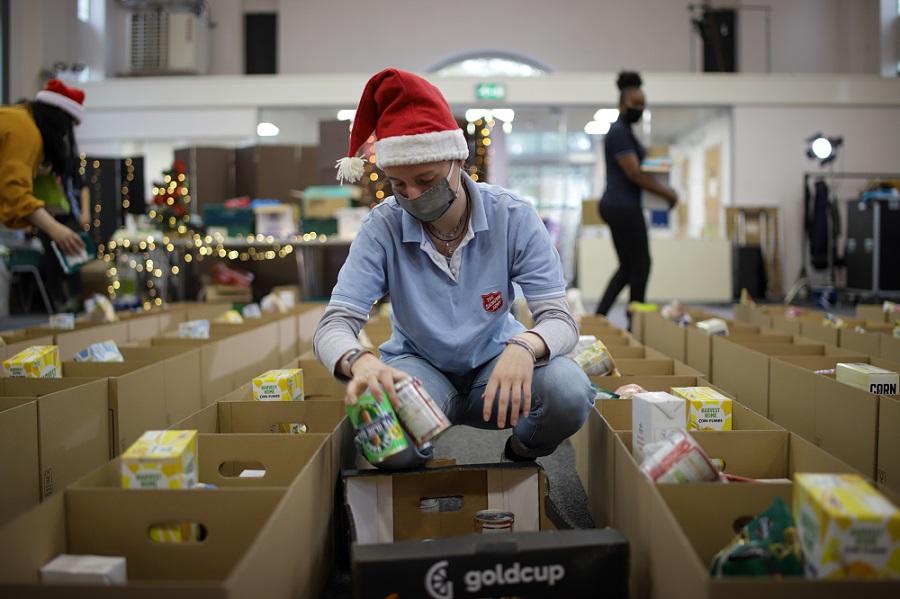 Person packing at a Christmas foodbank
