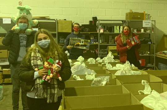 Volunteers with toys