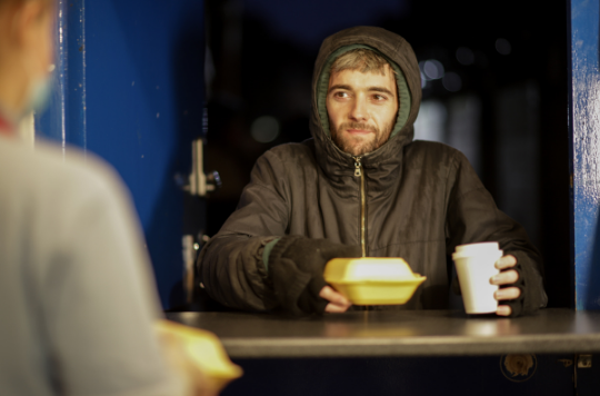Rough sleeper with hot food and drink