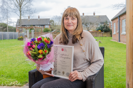 Sandy Cummins, Head of Care at Lyndon House care home, with her long service award