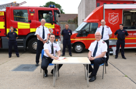 Salvation Army officers and staff with representatives of Essex Fire and Rescue
