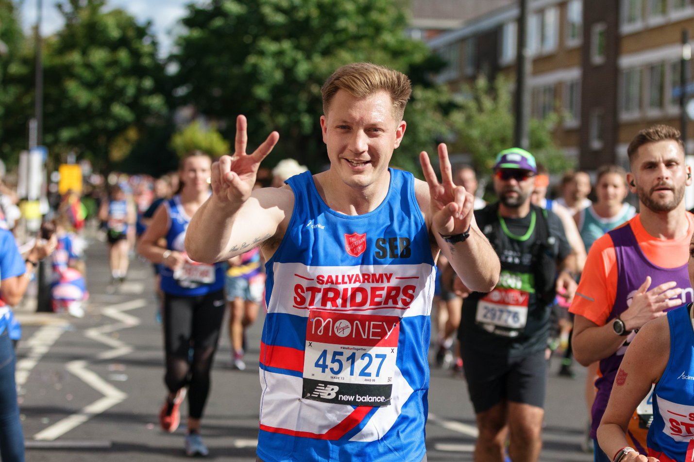 man running the London Marathon in Team Sally Army top