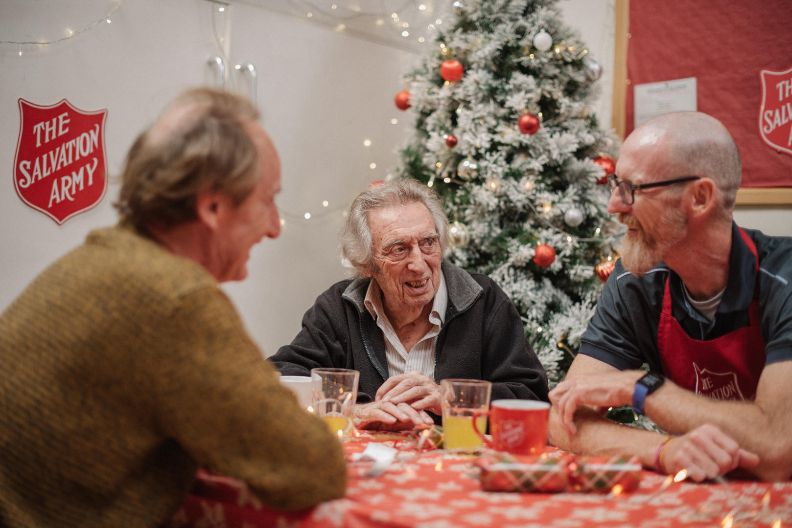 a group of people eating Christmas lunch at their local Salvation Army