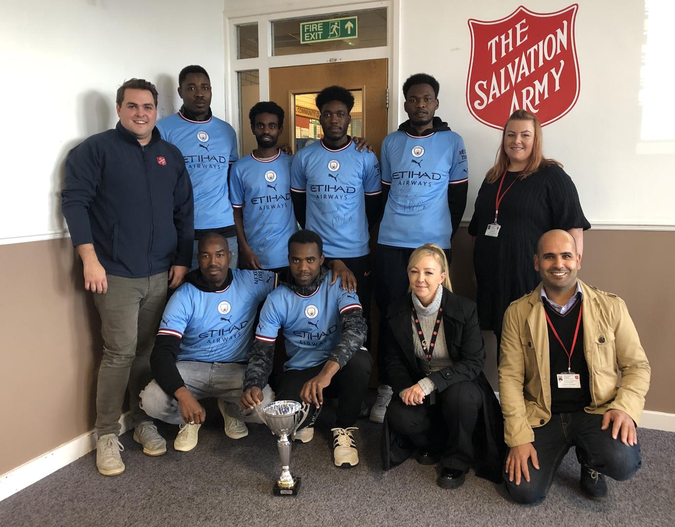 Users of The Salvation Army's Refugee Resettlement Service awarded signed Manchester City shirts.jpg