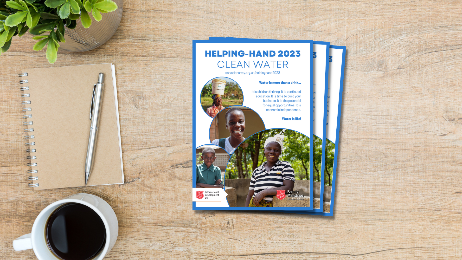 Three helping hand posters on table with coffee cup and notebook 