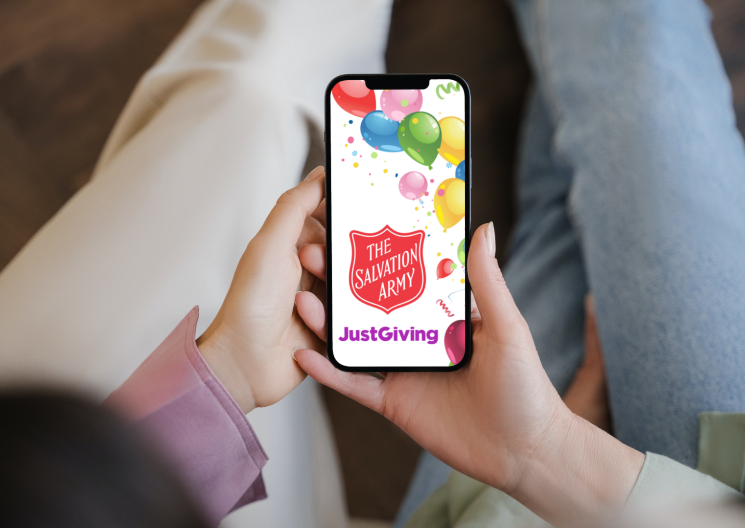 JustGiving and Salvation Army logo on phone