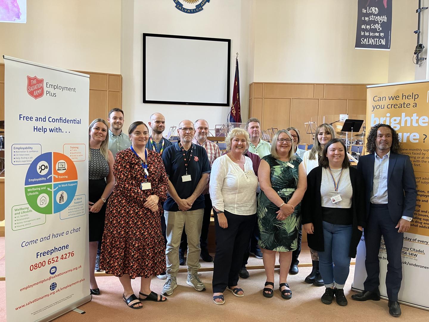 A group of people representing the partner groups involved in the Under One Roof service are pictured together at the launch in Bristol Citadel Salvation Army church.