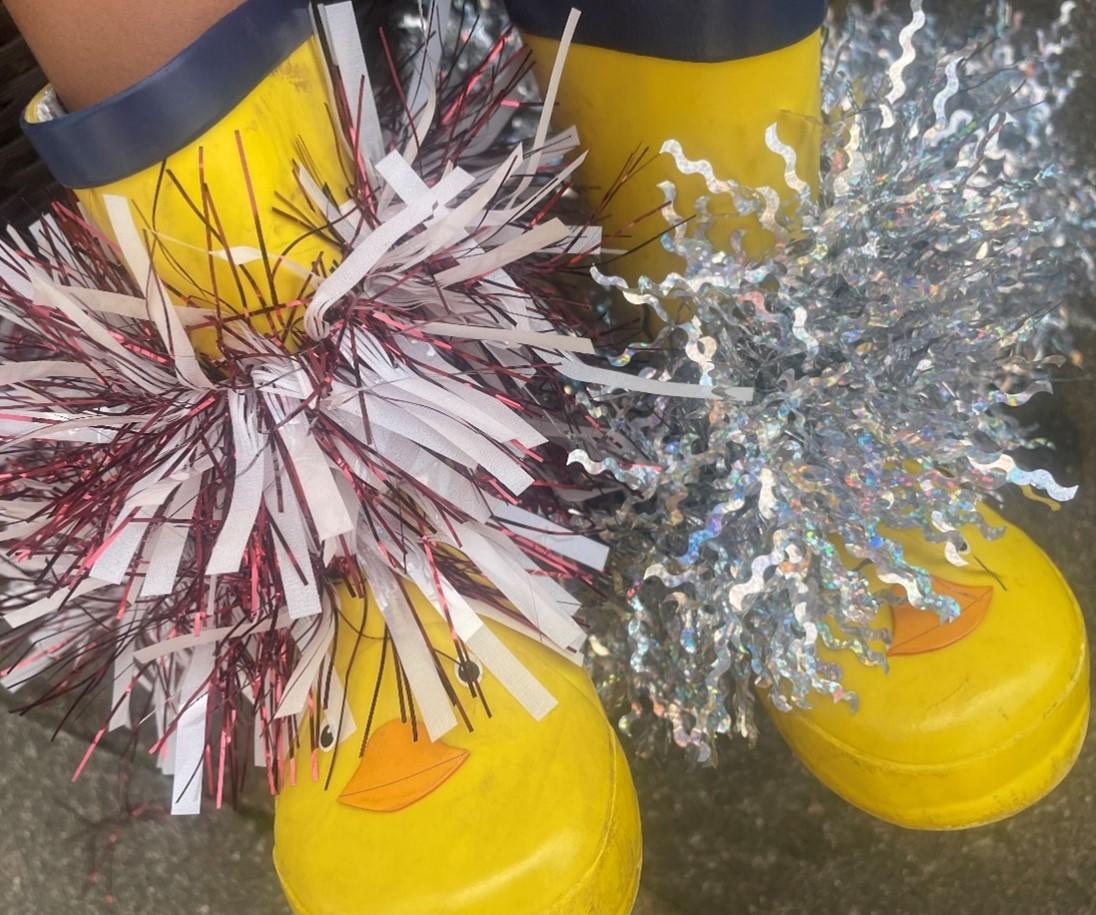 Pair of yellow wellies with tinsel