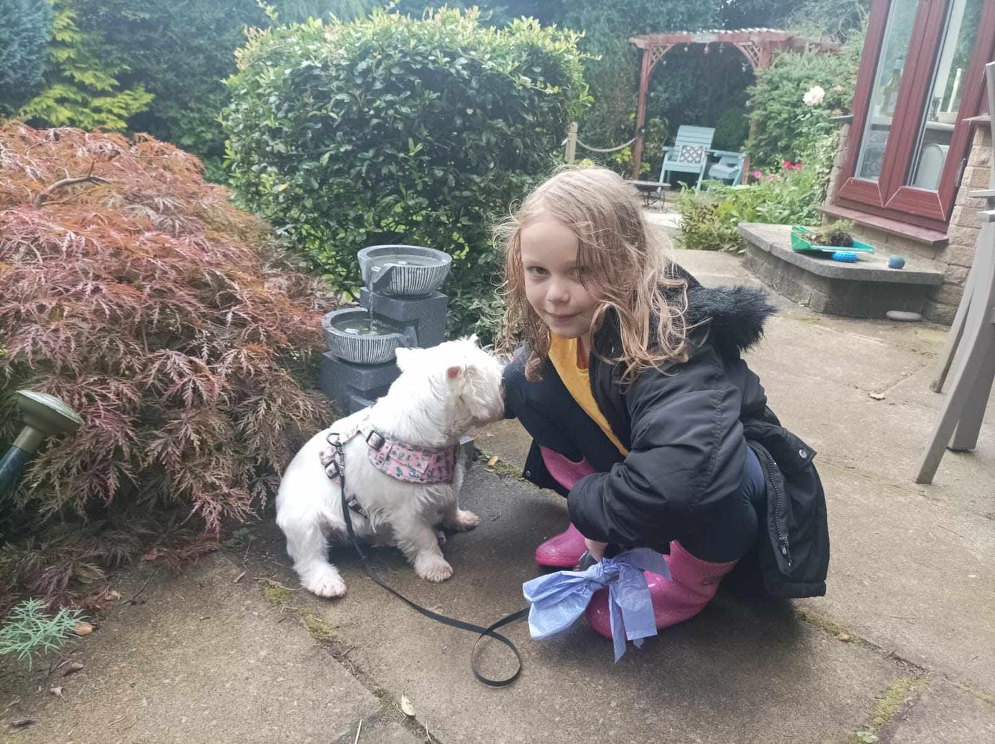 Schoolgirl, Ella, 8, walks dogs to raise funds for The Salvation Army