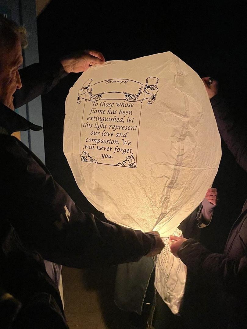 A Chinese lantern is released into the air to remember the lives lost 
