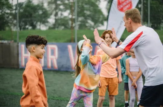 Picture of children high fiving 