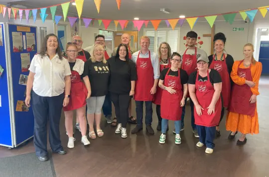 A group of people wearing aprons
