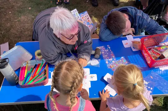 A picture of some children doing crafts