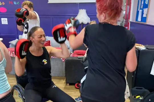 A picture of people with boxing gloves