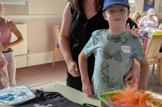 Picture of a little boy at a craft session 