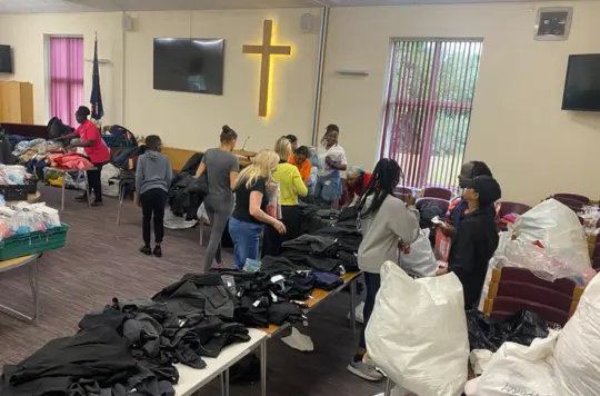 Tables with clothes llaid out 