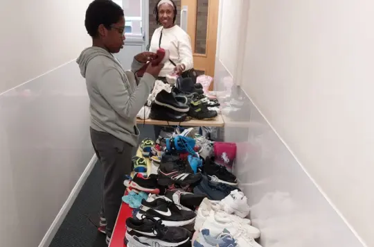 Tables with shoes laid out 