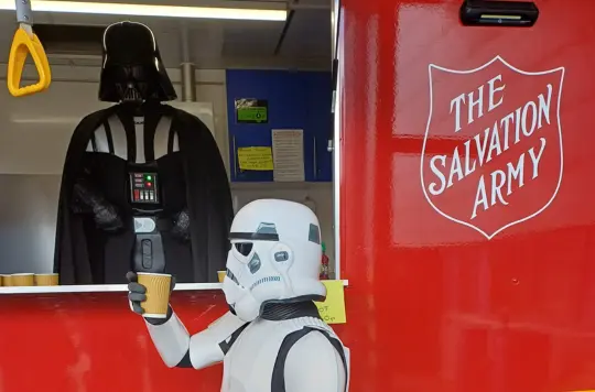 A picture of Darth Vader and a storm trooper at the emergency vehicle