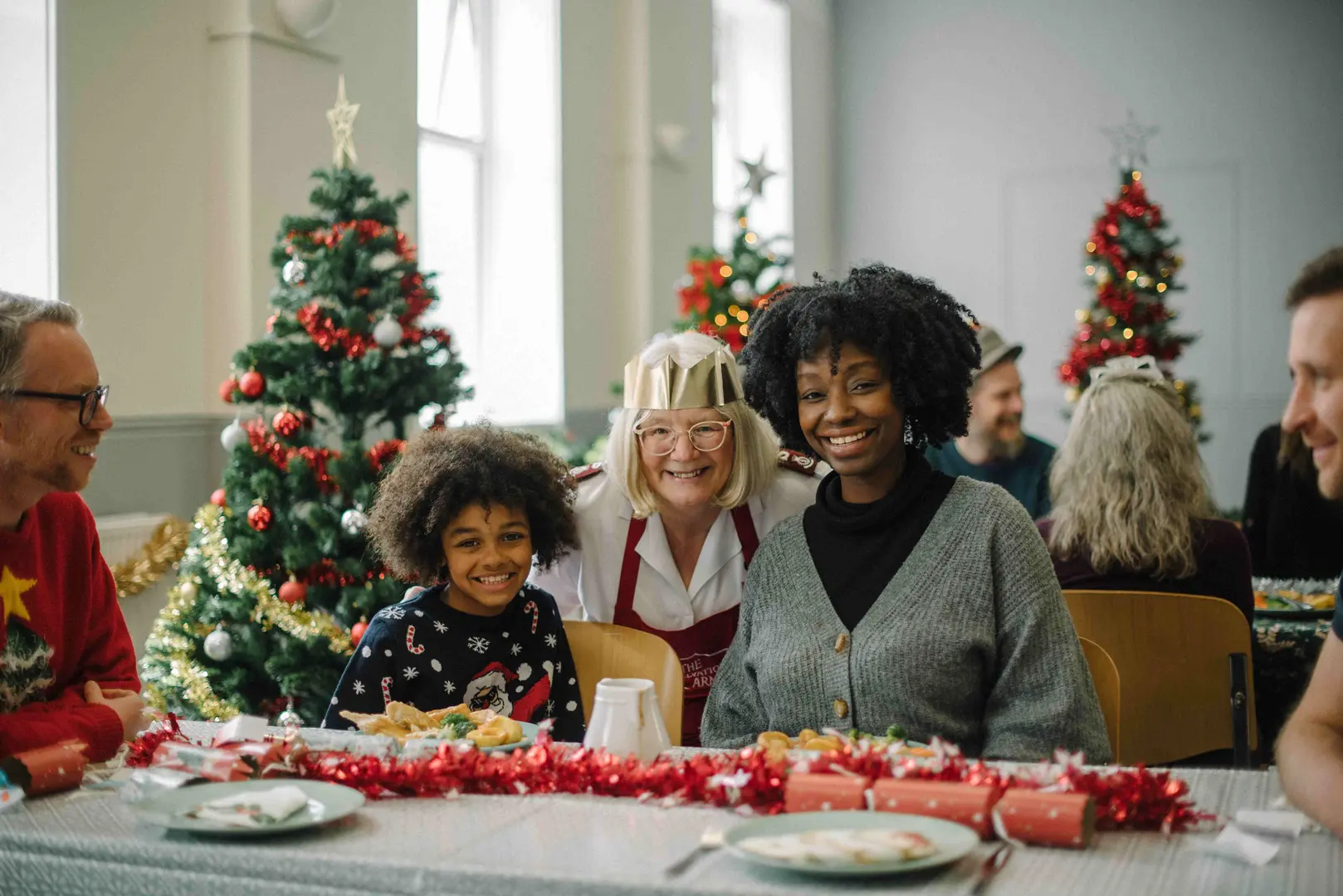 A mother and daughter enjoying a Christmas Meal at a Salvation Army Church.