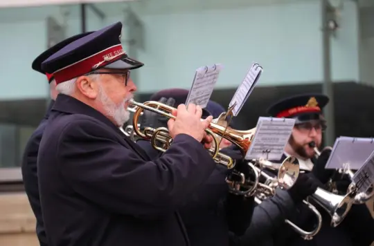 A picture of a man playing an instrument 