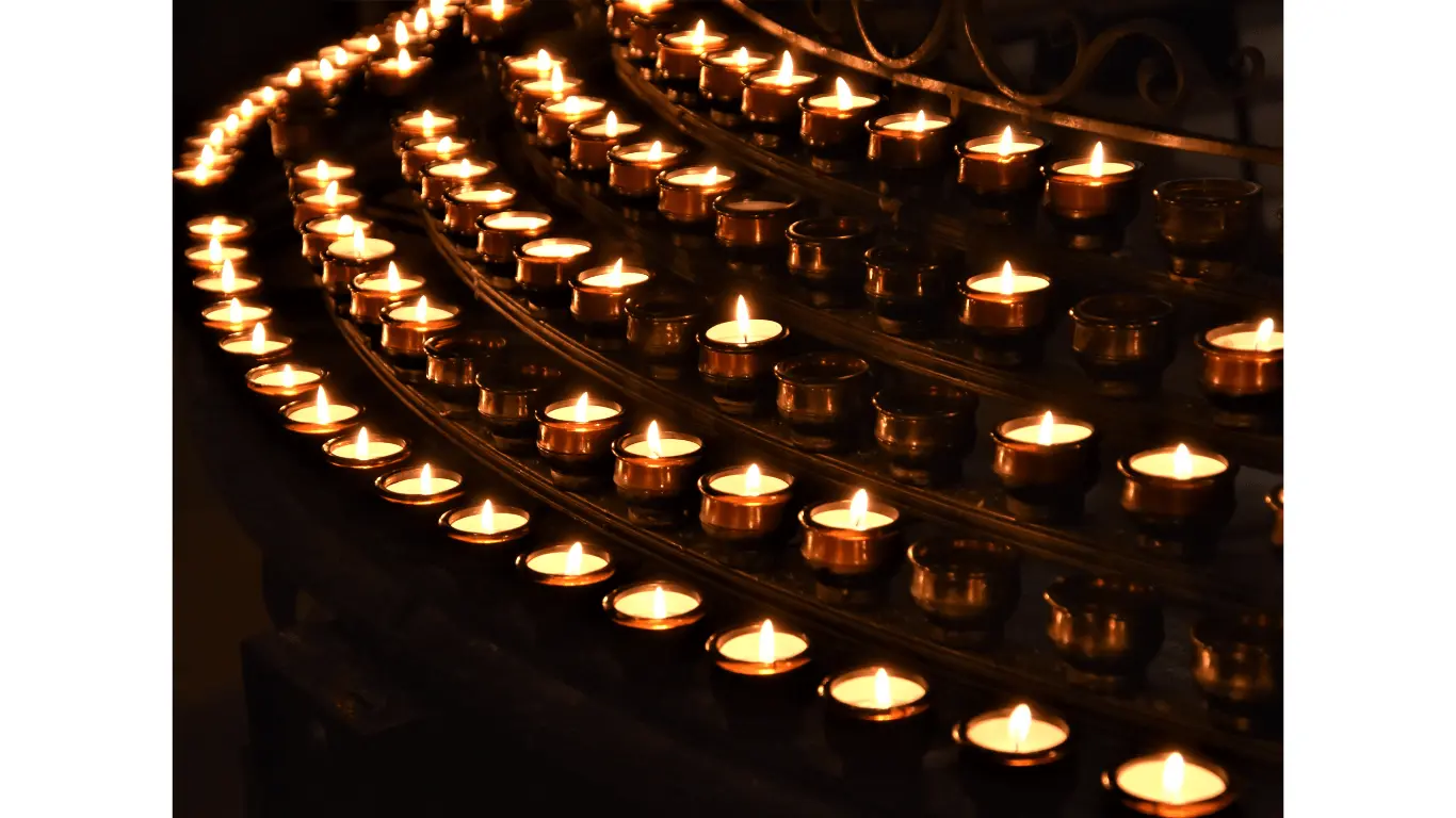 A large number of lit candles