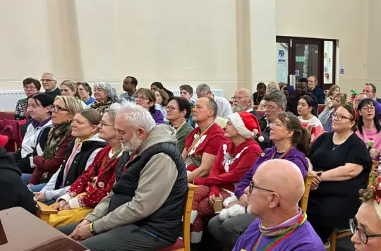 People sit during a Christmas service 