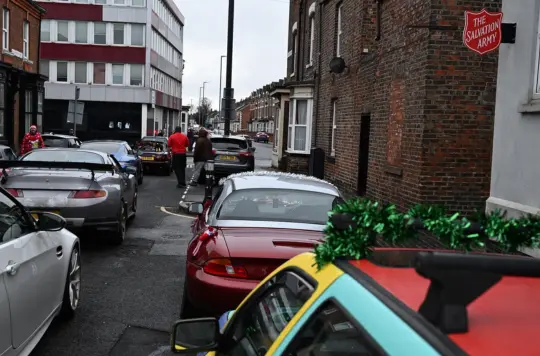 A picture of cars outside a Salvation Army hall 