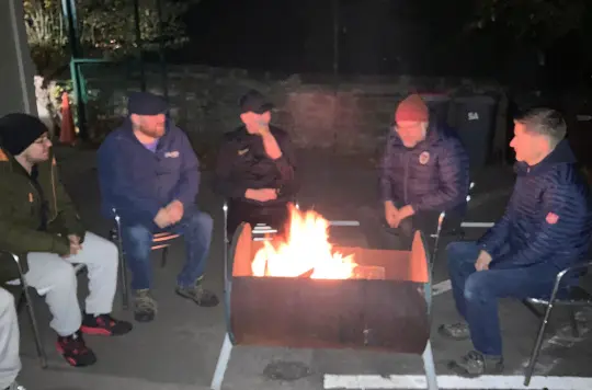 Men around a firepit