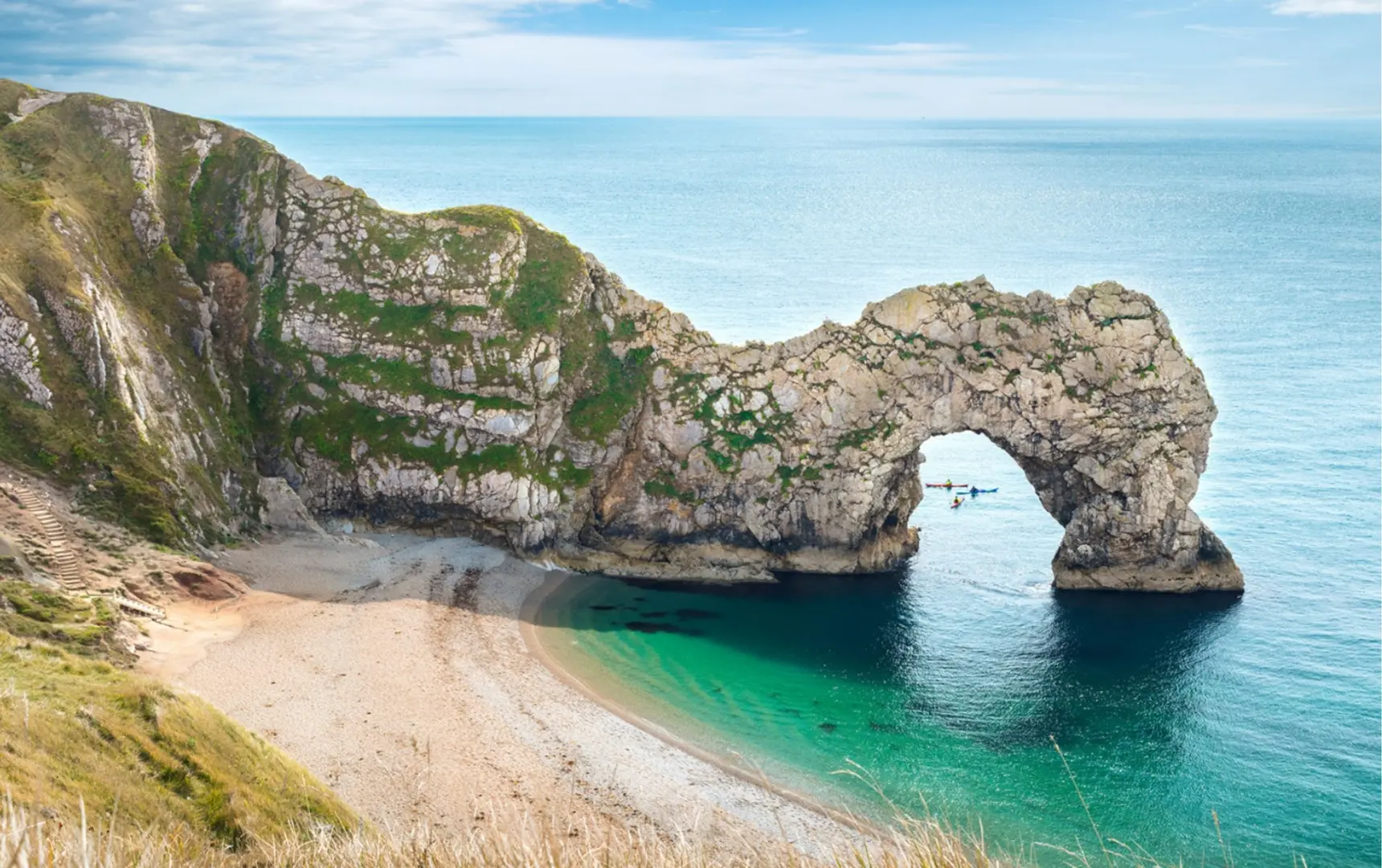 An image of the famous Durdle Door coastal arch, found on the Jurassic Coast trek.