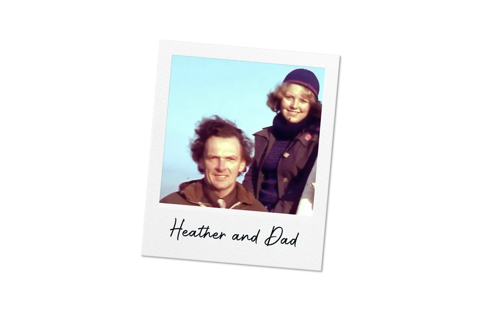 **Alt text:**   Polaroid-style photo of two people outdoors against a clear blue sky, with caption “Heather and Dad”.